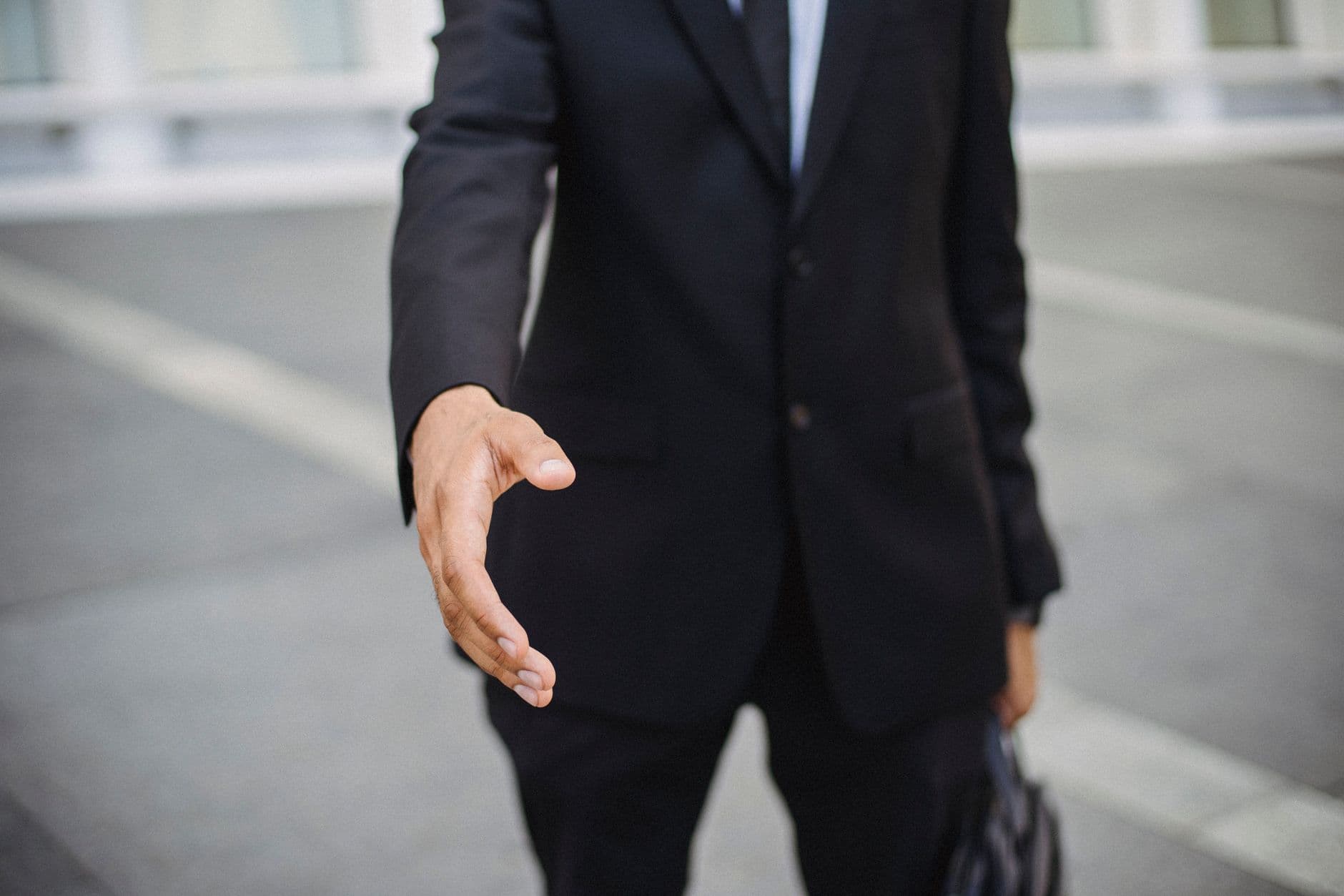 A welcoming handshake at the start of a meeting
