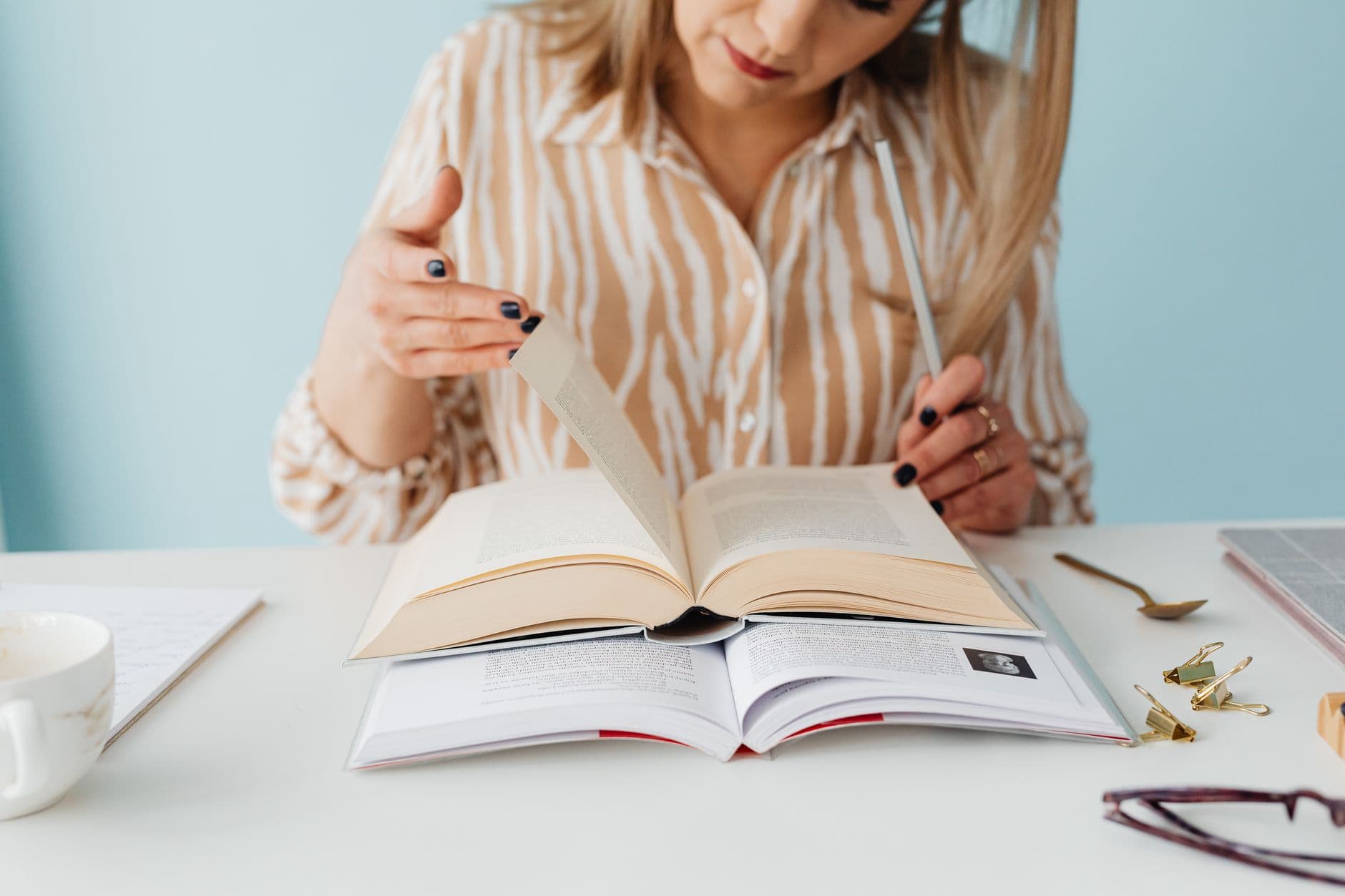 Notebook and reading material on a desk